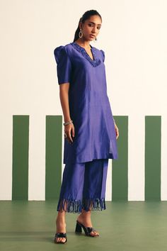 Ink blue kurta, accentuated with placement nalki, sequins embroidery. Paired with a pant with loop lace work.
Components: 2
Pattern: Embroidery
Type Of Work: Sequins, Nalki, Cutdana
Neckline: Notched Neck
Sleeve Type: Puff Sleeves
Fabric: Chanderi
Color: Blue
Other Details: 
Loop lace work on neckline
Occasion: Sangeet - Aza Fashions Blue Fitted Straight Kurta Pant Set, Blue Fitted Pant Set With Straight Kurta, Blue Silk Handloom Sets, Blue Handloom Sets With Traditional Drape, Traditional Blue Sets With Straight Pants, Blue Handloom Festive Sets, Festive Blue Handloom Sets, Traditional Blue Straight Pants Palazzo Set, Festive Blue Sets With Straight Pants