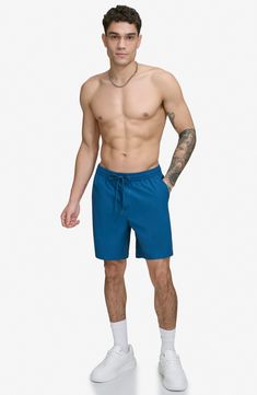 Seek out the gnarliest waves in short-lined quick-dry swim trunks made from a fabric featuring built-in sun protection. 7" inseam Elastic/drawstring waist Side welt pockets; back flap-patch pocket; drop-in mesh pocket UPF 40+ sun protection 92% REPREVE® recycled polyester, 8% spandex REPREVE recycled polyester is made from 100% post-consumer recycled plastic bottles Machine wash, tumble dry Imported 4-way Stretch Swim Trunks For Outdoor, Summer Nylon Swim Trunks For Workout, Summer Workout Nylon Swim Trunks, Blue Athletic Shorts With Drawstring For Summer, Blue Nylon Swim Trunks For Workout, Nylon Swim Trunks For Workout During Beach Season, Blue Functional Swim Trunks With 4-way Stretch, Blue Functional 4-way Stretch Swim Trunks, Go-dry Nylon Athletic Shorts For Beachwear