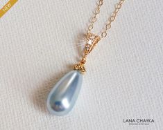 Wedding Light Blue Teardrop Pearl Gold Pendant Necklace with 14k Gold Filled Chain. CHAIN is 18 inches (45.7 cm) long, PENDANT is 1.06 inch (2.7cm) long including bail. BRIDAL NECKLACES SECTION: https://www.etsy.com/shop/LanaChayka?ref=seller-platform-mcnav§ion_id=11638944 BRIDAL JEWELRY SETS SECTION: https://www.etsy.com/shop/LanaChayka?ref=seller-platform-mcnav§ion_id=25839214 BRIDAL EARRINGS SECTION: https://www.etsy.com/shop/LanaChayka?ref=seller-platform-mcnav§ion_id=11638940 Elegant and ti Elegant Light Blue Necklace For Wedding, Elegant Light Blue Wedding Necklaces, Light Blue Teardrop Jewelry For Wedding, Elegant Light Blue Jewelry For Wedding, Wedding Light Blue, Wedding Teal, Pearl Wedding Necklace, Bridal Necklaces, Jewelry Classy