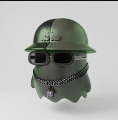 a green helmet with sunglasses and a chain around it's neck is shown in this image