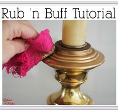 a person is cleaning a candle with a cloth on it and the words rub'n buff