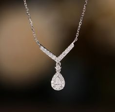 Elevate her elegance with our Solid 18K Gold Diamond Necklace, a radiant symbol of love and sophistication. Crafted with precision and passion, this exquisite necklace is designed to adorn the neckline of the woman who holds a special place in your heart - be it your mother, a cherished friend, or beloved partner. Each delicate link of this necklace is meticulously crafted from solid 18K gold, exuding luxury and timeless allure. At its center lies a dazzling diamond pendant, shimmering with bril 18k Gold Chain, Wedding Engagement Gifts, Gold Diamond Necklace, Pear Diamond, Handmade Wedding, Necklace For Women, Gift For Women, Diamond Pendant, Gold Chains