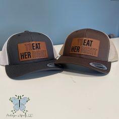 Experience retro style and comfort with our TrEAT HER Right Leather Patch Trucker Hat! Made with high-quality materials, this hat features a unique leather patch design that adds a touch of sophistication to any outfit. Perfect for both men and women who want to make a statement and show off their love for good treats! TrEAT HER Right Leather Patch Unisex Adult Retro Trucker Caps/Hats are 65/35 polyester/cotton, structured, mid-profile, six panel, with a snapback closure. The leather patch designs are affixed with adhesive for very secure attachment to the hat. Due to monitor colors, patches and hat colors may be slightly different in person. Custom leather patch hats are made from laser-engraved LEATHERETTE material. Over 40 color choices are available. THIS IS A PHYSICAL PRODUCT! Casual Brown Leather Snapback Hat, Casual Brown Hat With Letter Patch, Casual Brown Leather Trucker Hat, Trucker Hat With Leather Patch And Short Brim, Adjustable Brown Baseball Cap With Letter Patch, Retro Brown Snapback Hat For Outdoor, Retro Brown Snapback Hat With Short Brim, Adjustable Brown Hat With Letter Patch, Casual Brown Hat With Patches