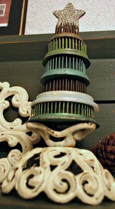 an assortment of decorative items on display in a store window, including pine cones and ornaments