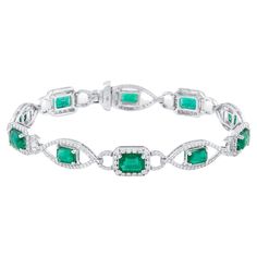 Tresor Diamond Bracelet features 1.96 cts diamond and 6.64 cts emerald in 18k white gold. The Bracelet are an ode to the luxurious yet classic beauty with sparkly diamonds. Their contemporary and modern design makes them versatile in their use. The Bracelet are perfect to be worn daily, at parties, music galas, charity events, conferences, and even weddings. Charity Events, Emerald Diamond, Classic Beauty, Pandora Charm Bracelet, Diamond Bracelet, Jewelry Bracelets, Emerald, Modern Design, Charm Bracelet