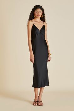 Our renowned silk slip dress ushers in a new era of luxury loungewear–the Issa Jet Black is an ultra-modern twist on the classic silk slip dress. The vivid colourway, the finest silk, the elegant bias cut–discover the perfect evening dress, for any occasion. \n\n Material: 100% silk Material Weight: 19 momme Material Weave: silk satin Colour: black Trims: adjustable flat straps Product Code: CT0012 Black Silk Slip Dress, Issa Dresses, Black Satin Slip Dress, Holly Golightly, Olivia Von Halle, Luxury Loungewear, Slip Skirts, Black Slip Dress, Slip Dresses