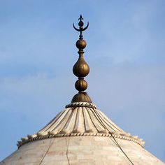 the top of a building with a clock on it