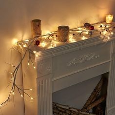 a fireplace with some candles on top of it