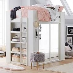 a white loft bed sitting under a window