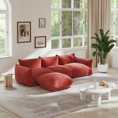 a living room filled with furniture and windows