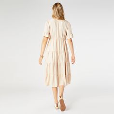 Say hello to the Margaux Tiered Ruffle Sleeve Dress, the epitome of effortless style! With its relaxed fit, this dress ensures you feel comfortable and confident all day long. The longer ruffle sleeves add a chic twist, while the decorative buttons give it a hint of sophistication. Plus, it's equipped with pockets to keep your essentials close at hand. Perfect for both casual outings and special events, this dress is a must-have in your wardrobe! Materials: Viscose. Poncho Jacket, Ruffle Sleeve Dress, Flutter Sleeve Top, Poncho Sweater, Decorative Buttons, Pocket Leggings, Pink Maxi Dress, Ruffle Sleeves, V Neck Tops