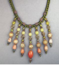 a necklace with many beads hanging from it