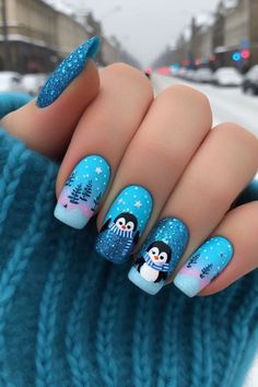 61 Stunning Blue Christmas Nail Ideas for 2024 Blue Nail Designs Christmas, December Nail Art Designs, Christmas Nails Fun, Christmas Nail Designs 2024, Christmas Nail Designs Purple, Teal Christmas Nails, Blue Nail Christmas Design, Christmas Nail Ideas Winter, Christmas Nails Purple