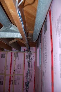 the electrical wires are plugged into the wall in the room that is under construction