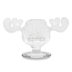 a glass candle holder with a moose's head on it and two antlers sticking out of the top