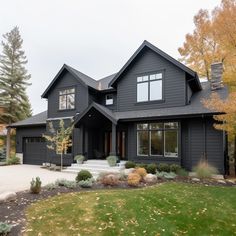 a large gray house with lots of windows