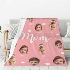 a pink blanket with the words mom printed on it and photos of two children's faces