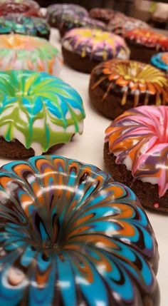 there are many colorful donuts on the table