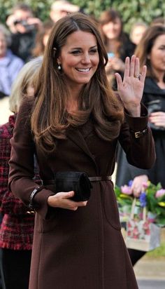 the duke and princess of cambridge wave as they walk past people onlookers