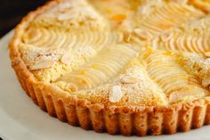 a close up of a pie with almonds on it