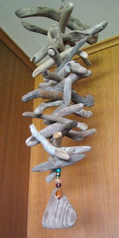 a tree made out of driftwood and beads