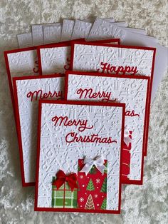 four christmas cards with the words merry and presents on them, all in red and white