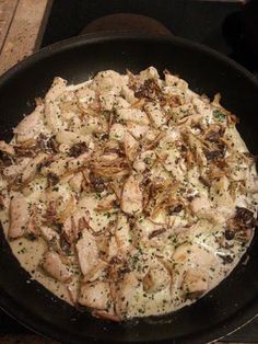 a pan filled with food sitting on top of a stove