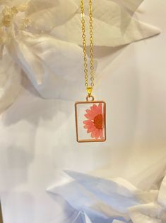 These unique botanical flowers have been pressed and set in resin in these beautiful metal bezel.  They're extremely light and dainty. They make an amazing gift for a girlfriend, bestfriend, teacher, mom, family member, or whoever it may be. It's the perfect gift for any occasion - whether it be a wedding gift, anniversary gift, Christmas gift, birthday gift, Mother's Day gift, or a just-because gift. They're a great addition to anyone's collection to rotate the accessories and match with an outfit! Slight differences in these jewelry are possible and bubbles may occur, but I will do my best to ensure attention to detail is unmatched. HOW TO CARE: Unfortunately, this resin is not scratch-proof so avoid sharp edges. You may also want to remove them for styling/heat products and water sports Pressed Sunflower Necklace, Pressed Flowers Resin, Flowers Resin, Pink Sunflowers, Jewelry Real, Sunflower Necklace, Teacher Mom, Just Because Gifts, Resin Necklace