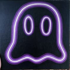 a purple and white ghost with two eyes on it's face is seen in this image