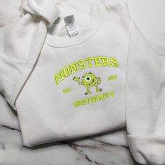 👕👕Sweatshirt Monster's University Crewneck Embroidered - Embroidered Hoodie Sweater - Couple Sweatshirt Hoodie - Custom Embroidered Gift 👕👕 ☑️Product detail: - 35% cotton, 65% Polyester - Size as depicted in size chart image ✈🚛Delivery time Our estimated delivery time is 7-15 days for orders to the United States and 15-30 days for orders to other countries. This time is calculated from the time the order is sent, not including order processing time. ⚠️If your order does not arrive within the expected time, please contact us for assistance. We will try our best to solve the problem for you. Couples Sweatshirts Hoodie, Monster S, Vintage Christmas Shirt, Monster Hoodie, University Crewneck, University Hoodie, Hawaiian Shirt Women, Mike Wazowski, Monsters University