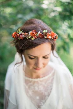 a woman wearing a flower crown on her head