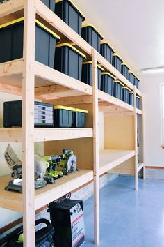 the shelves are filled with black containers and other items