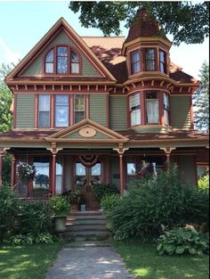 an old victorian style house with many windows