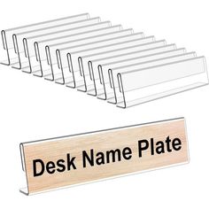 a wooden desk name plate with six rows of office supplies in front of the sign that says desk name plate