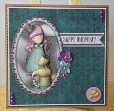 a handmade birthday card with a girl holding a baby in her arms and the words happy birthday written on it