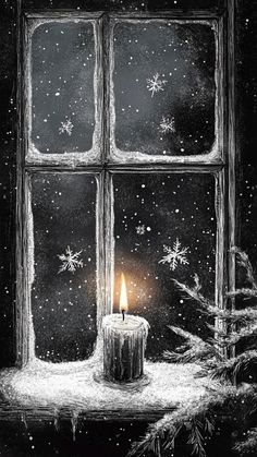 a lit candle sitting in front of a window with snow falling on the windowsill