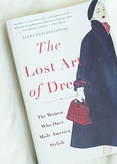 the lost art of dress book on a bed