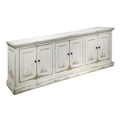 an old white cabinet with four doors on the front and two drawers on the back