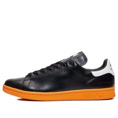 adidas Raf Simons x Stan Smith Shoes 'Black Orange' BB2647 Adidas Running Sneakers With Contrast Sole, Adidas Sneakers With Contrast Sole For Running, Modern Adidas Sneakers With Round Toe, Urban Adidas Low-top Custom Sneakers, Urban Low-top Custom Adidas Sneakers, Casual Custom Sneakers With Adidas Logo, Black Athleisure Sneakers With Gum Sole, Adidas Logo Custom Low-top Sneakers For Streetwear, Adidas Logo Low-top Custom Sneakers For Sports