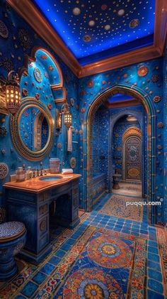 a bathroom with blue walls and an intricate ceiling