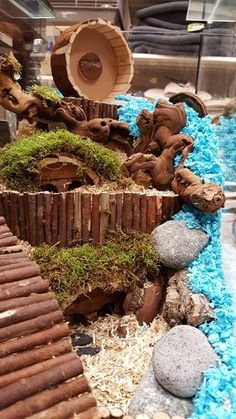 a close up of a fake garden with rocks and grass