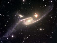 an image of a spiral galaxy in the sky