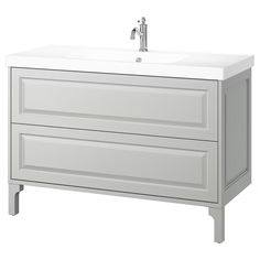 a white bathroom vanity with two drawers and a faucet on the sink side