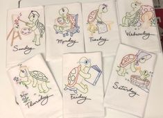 embroidered tea towels with children's drawings on them