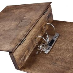 an old wooden box with eye glasses on it