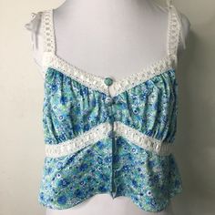 New For Love & Lemons Blue Floral Bralette Size Large. Aprox Measurements: Armpit To Armpit Is 15.5" Inches. Length Is 10.5" Inches. Has An Undone Ribbon. Please Look At Pictures For Better Reference. Happy Shopping! May22. T25 Blue Camisole Crop Top For The Beach, Blue Bohemian Cami Tank Top, Blue Cami Crop Top For Beach, Blue Cami Crop Top For Vacation, Blue Cami Crop Top For The Beach, Blue Lace Trim Tank Top For Spring, Turquoise Sleeveless Tank Top For Summer, Blue Camisole Crop Top For Spring, Turquoise Tank Top For Summer