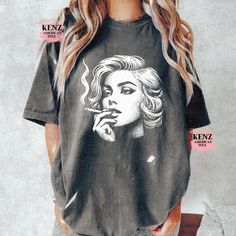 Blondie Y2k T-Shirt, Vintage 90s Style Shirt, Cute Soft Distressed Tee, Unisex Oversized Washed Y2k Shirt, Gothic Baggy shirt, Gothic Gifts 90s Style Graphic T-Shirt, Retro Raccoon Shirt, Trendy Shirts, Adult Unisex Relaxed Shirt, Washed Tee Browse our selection of more shirts/sweatshirts ------ https://www.etsy.com/shop/KenzAmericanTee?ref=seller-platform-mcnav NOTE: We use Comfort Color tees for Vintage Distressed and Grey Distressed             We use Gildan tees for all other colors. ✿ Shirt Oversized Y2k Short Sleeve T-shirt, Y2k Relaxed Fit T-shirt With Funny Print, Oversized Y2k T-shirt With Screen Print, Acid Wash Oversized Vintage Tops, Oversized Acid Wash Vintage Tops, Oversized Vintage Acid Wash Tops, Oversized Vintage Distressed Top, Oversized Y2k Cotton Tops, Oversized Cotton Y2k Tops