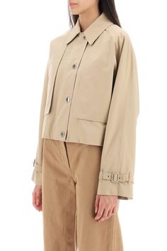 This Burberry cropped jacket is cut from lightweight cotton gabardine and boasts a double layer design, composed of a sleeveless base and a non-removable long-sleeved overlay. It closes with a double-slider zip beneath a snap placket and features a shirt collar with throat latch, side welt pockets and two inside pockets. The dolman sleeves bear a raglan cut on the back and belted cuffs. Burberry Check cotton lining. The model is 177 cm tall and wears a size UK 6. Size Info UK Color Detail Beige Summer Images, Layer Design, Cropped Jacket, Jacket Sale, Roberto Cavalli, Burberry Bag, Layers Design, Crop Jacket, Shirt Collar