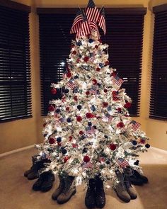 a white christmas tree with red, white and blue decorations