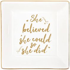 a white and gold square plate with the words she believed she could so she did